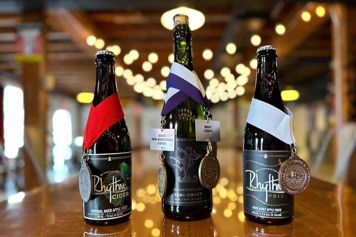 two bottles of beer sitting on top of a table