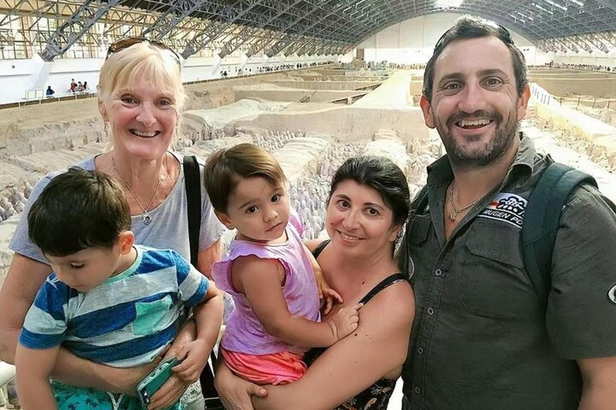 a group of people posing for a picture in a stadium