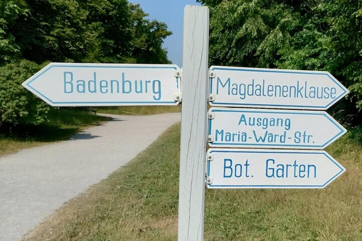 a pole with street signs on a road