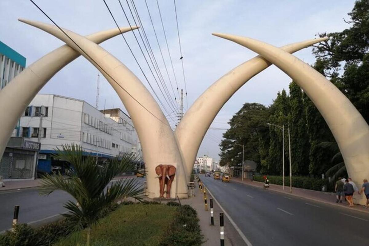 a view of a street with a sculpture of a building