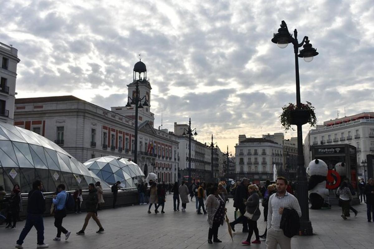 a group of people walking on a city street
