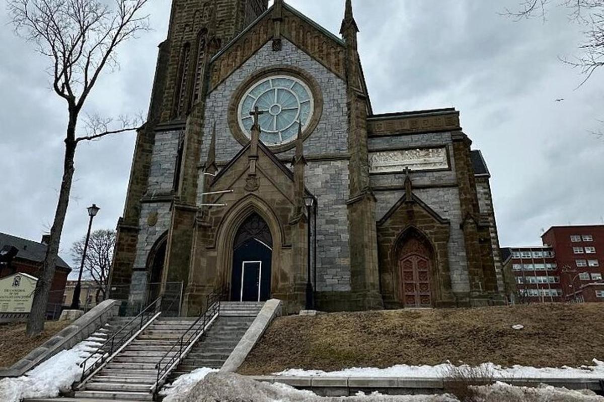 an old church with a clock on the front of it