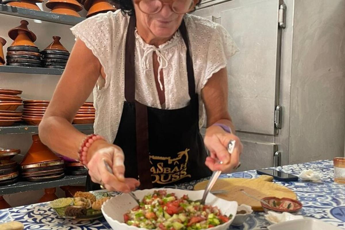 a woman in a kitchen preparing a bowl of food