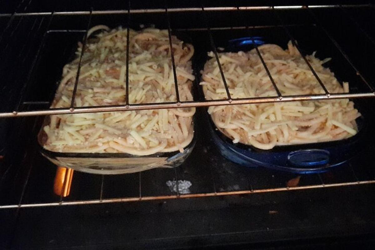 three pizzas are sitting in an oven
