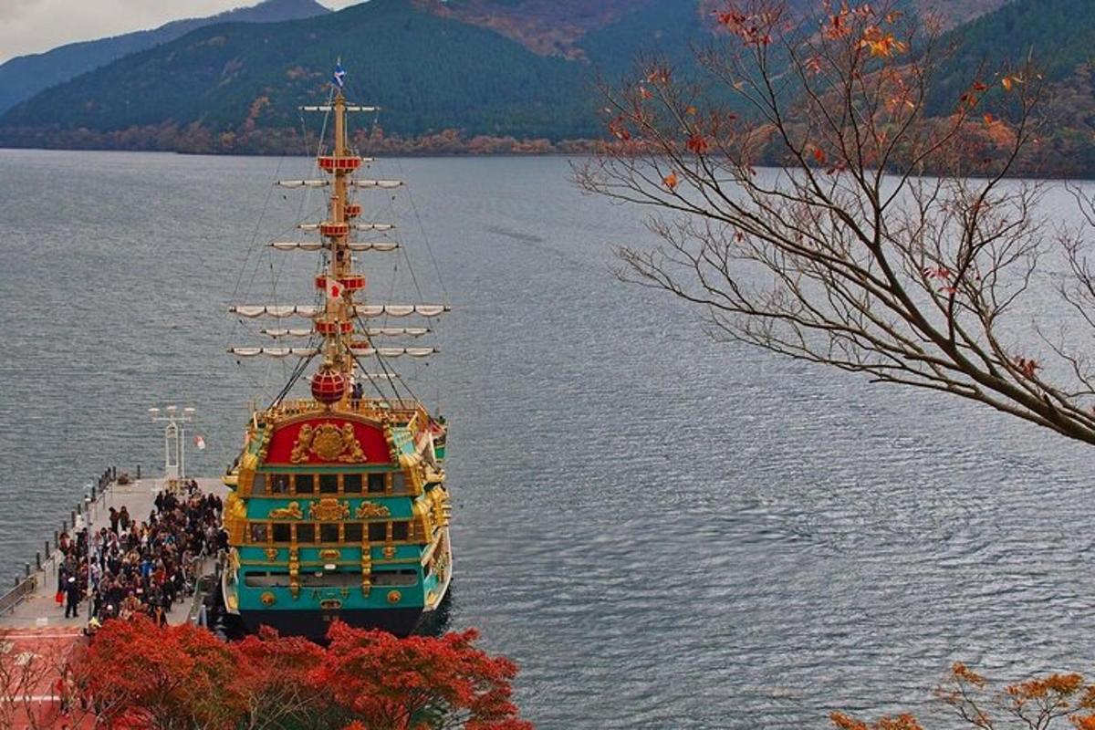 a large boat on a lake with a group of people on it