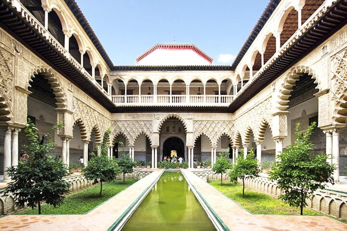 a courtyard with a pool of water in a building