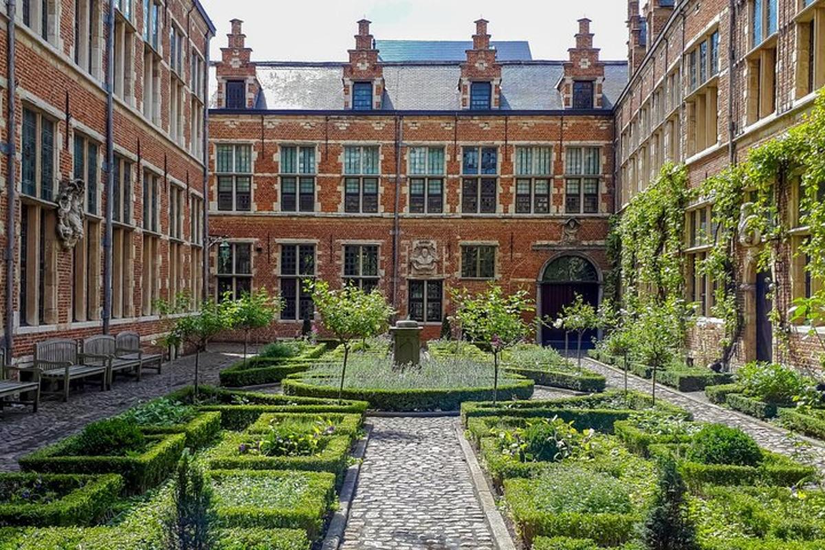 a courtyard with a garden in front of a building