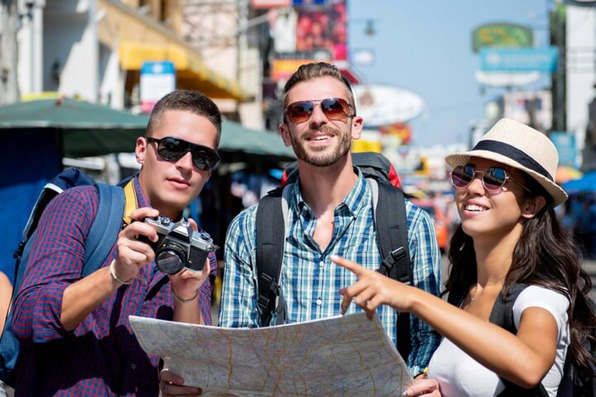 a group of three people looking at a map