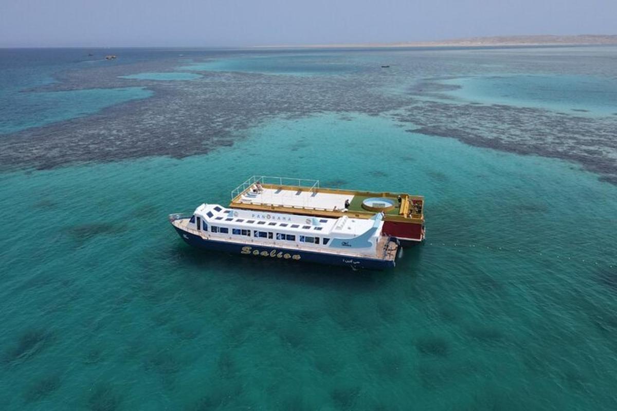 a boat floating in the water in the ocean