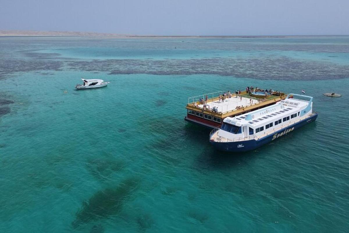 a boat and a small boat on the water