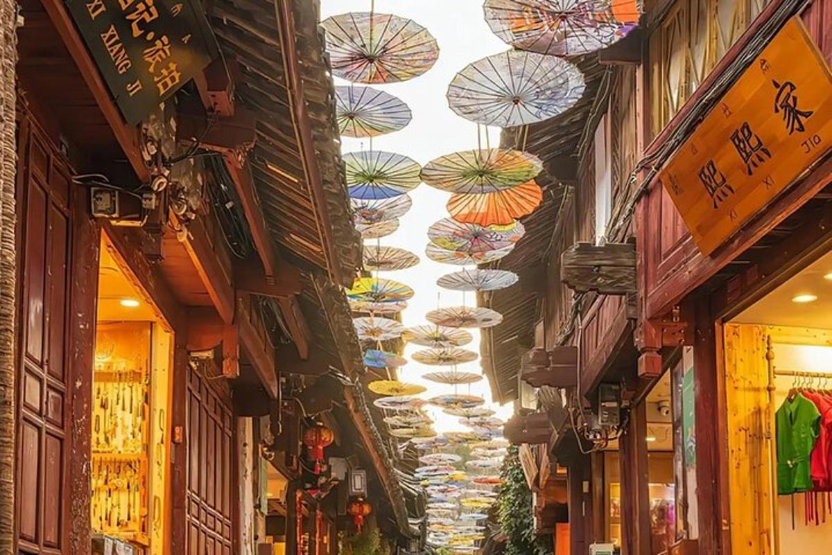 a row of umbrellas hanging from the ceilings of a street