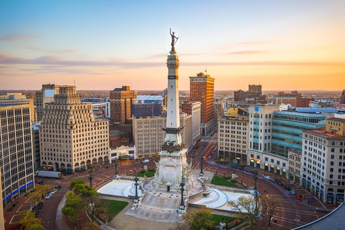 a view of a city with a statue on a tower