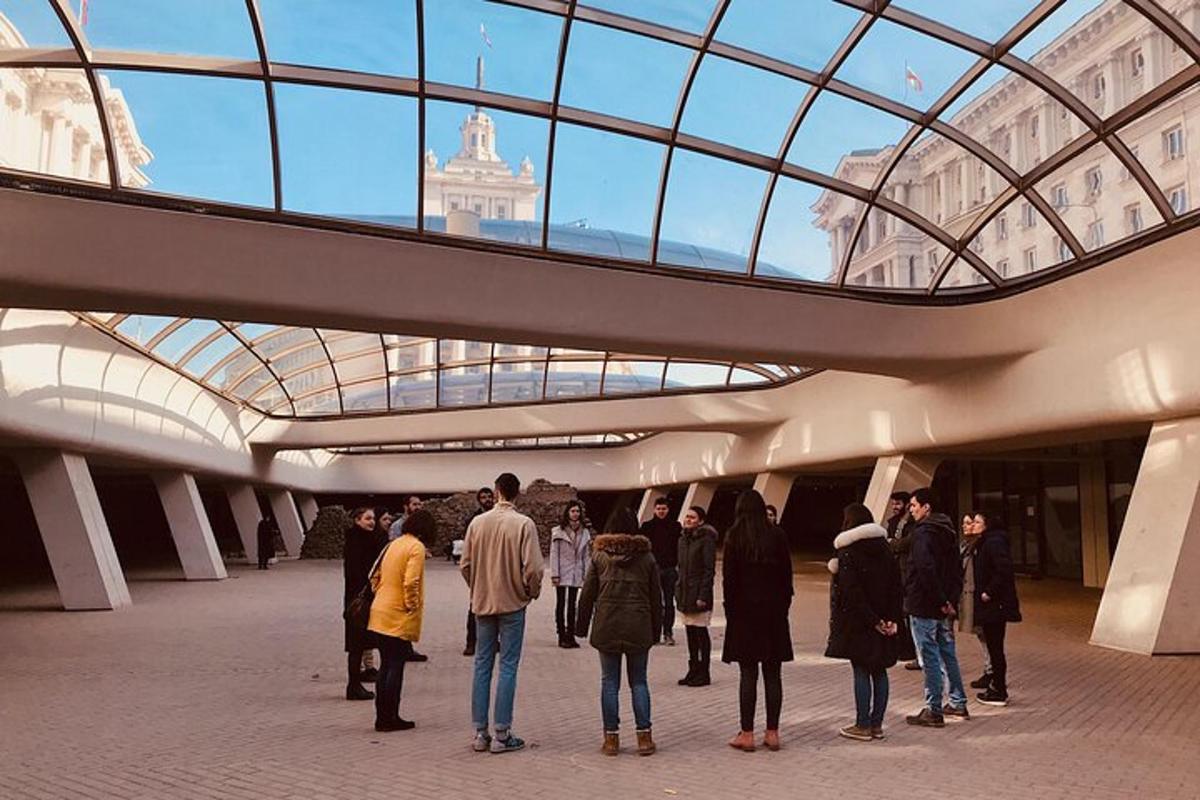 a group of people standing inside of a building