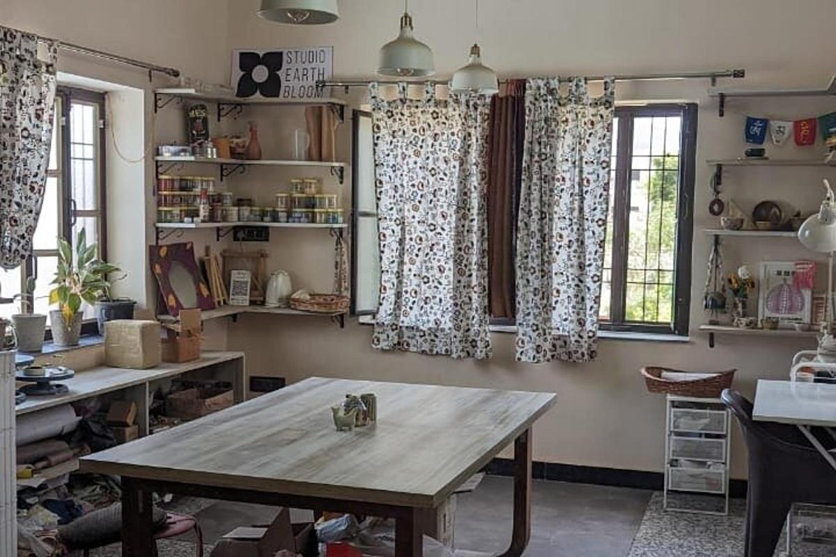a room with a table and two windows