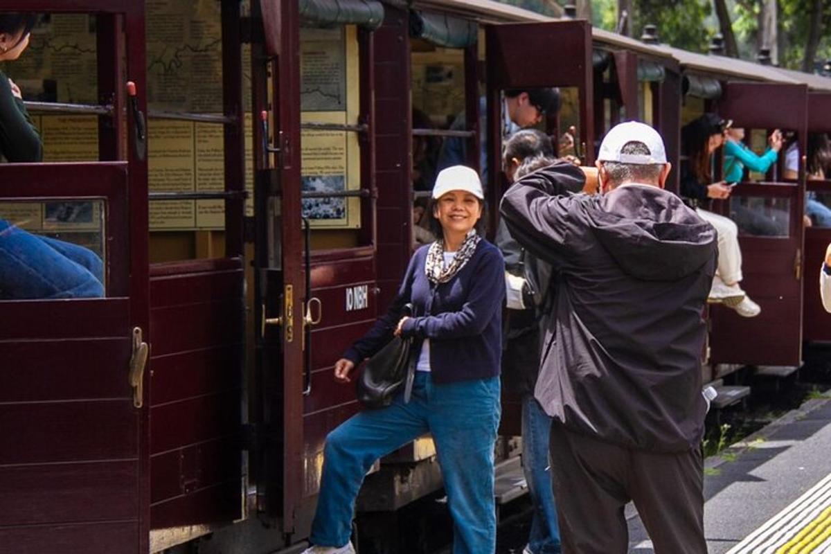 a group of people getting on a train