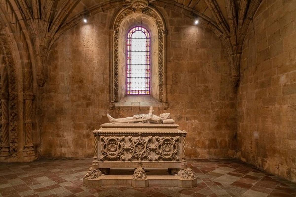 a room with a statue in a building with a window