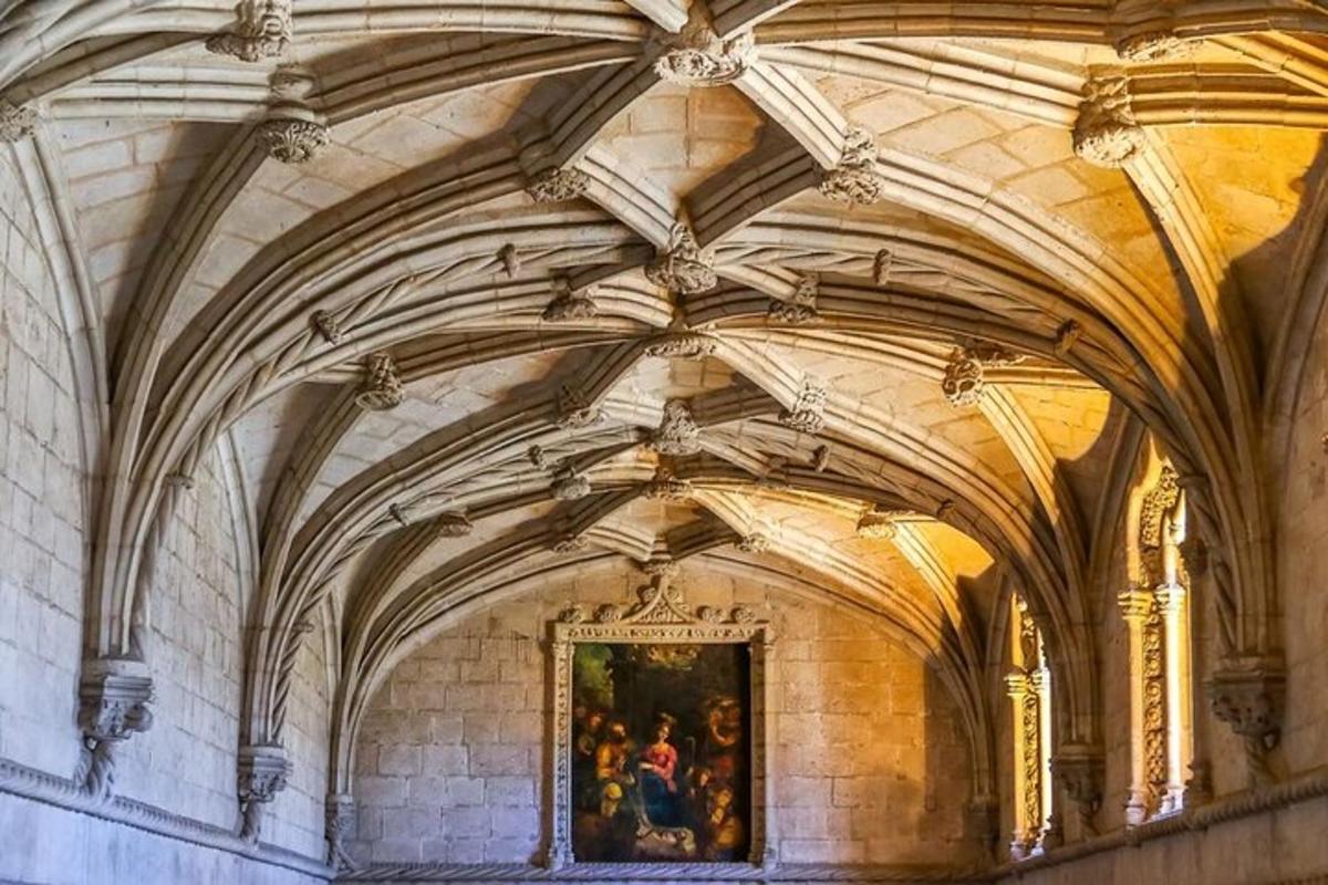 an ornate ceiling in a building with a painting