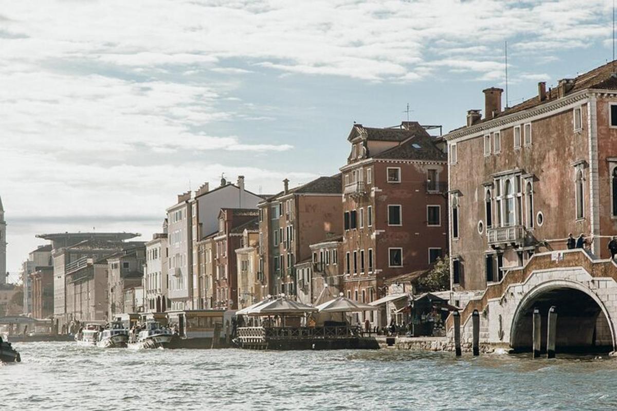 a view of a canal with buildings and a bridge
