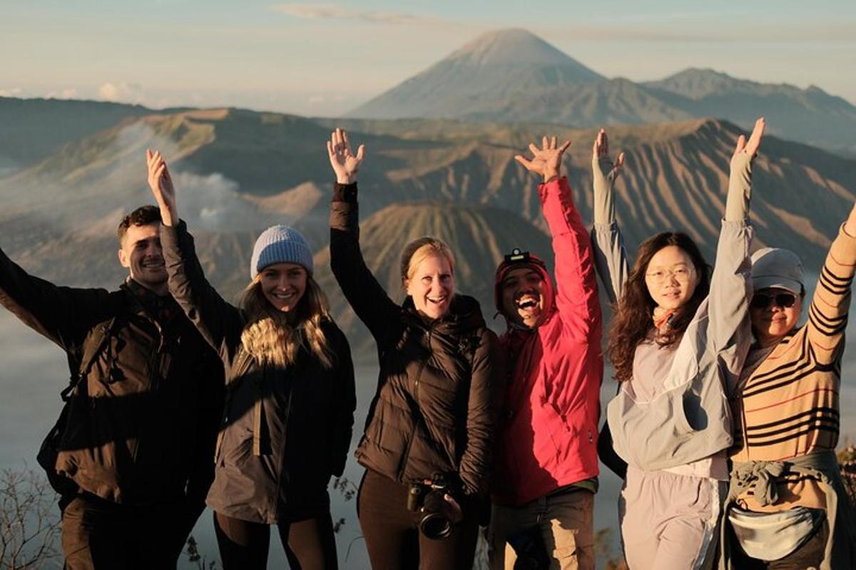 a group of people standing on top of a mountain