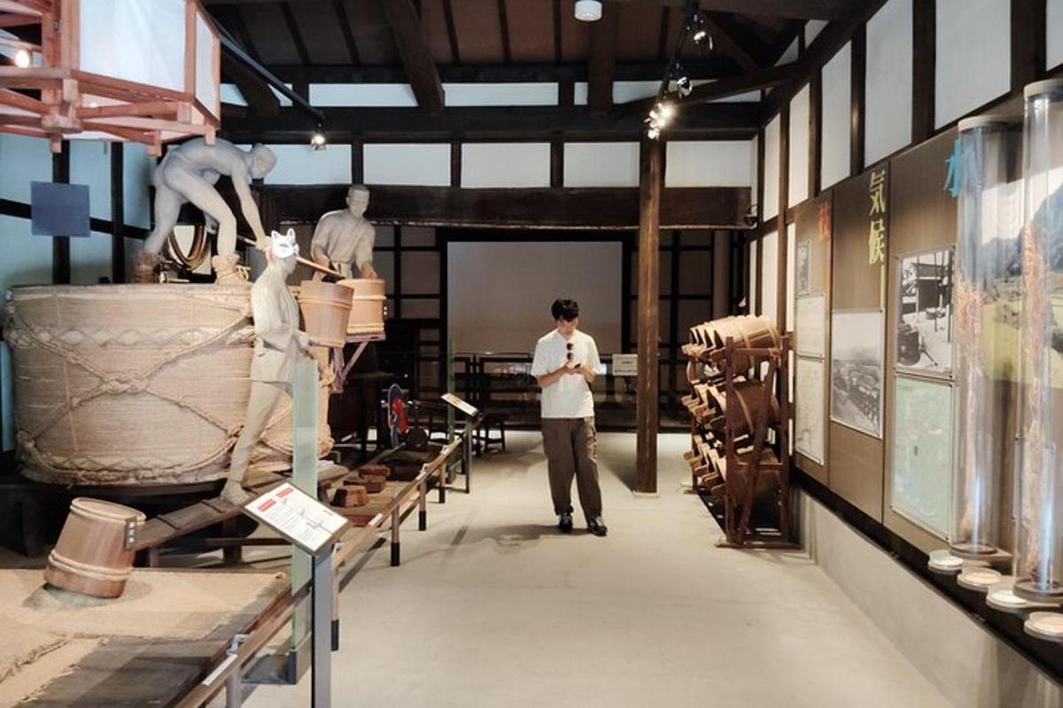 a group of people standing in a museum with artifacts