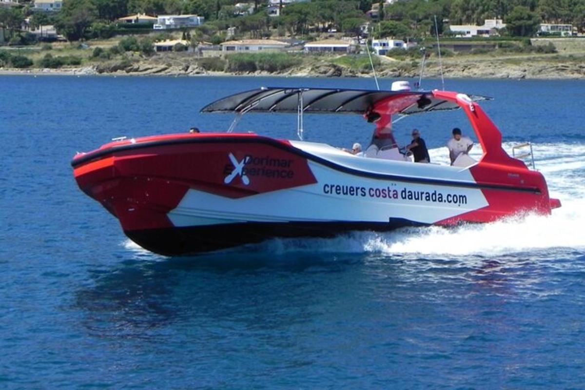 a red and white boat in the water