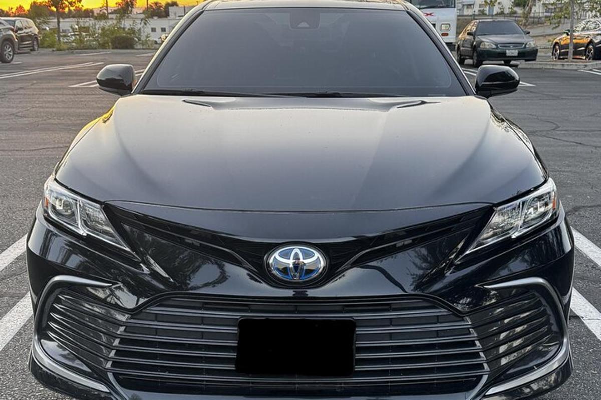 a front view of a toyota car parked in a parking lot