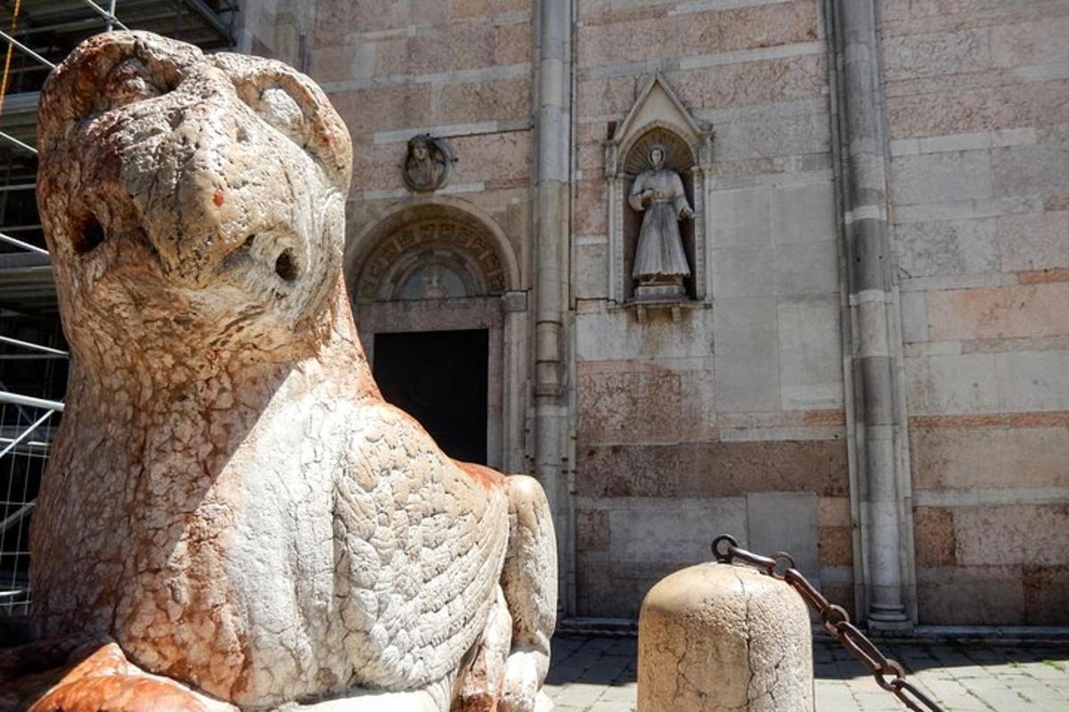 a statue of a bear in front of a building