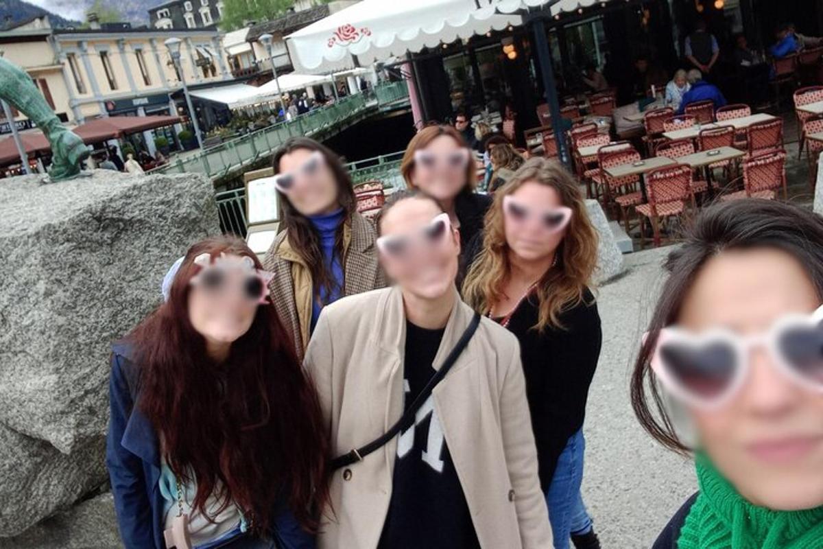 a group of girls with their faces in their heads