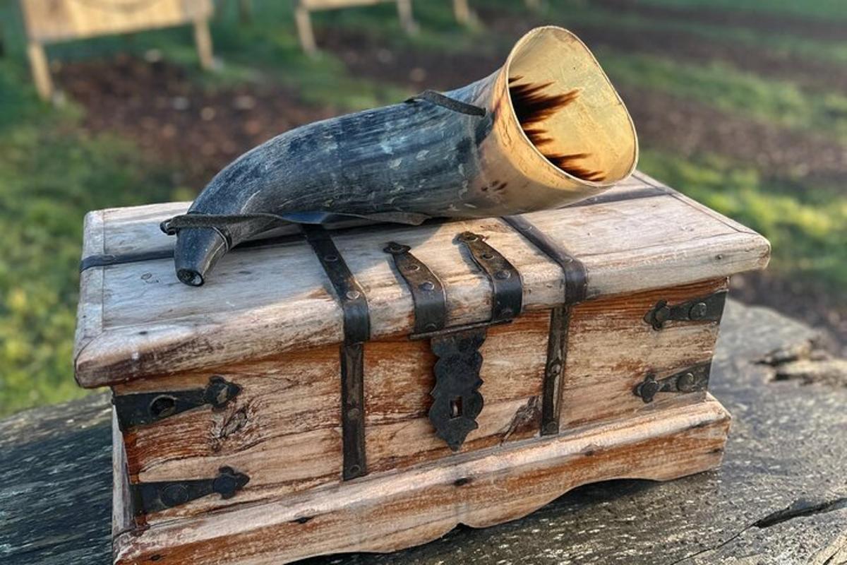 a bird statue sitting on top of a wooden box