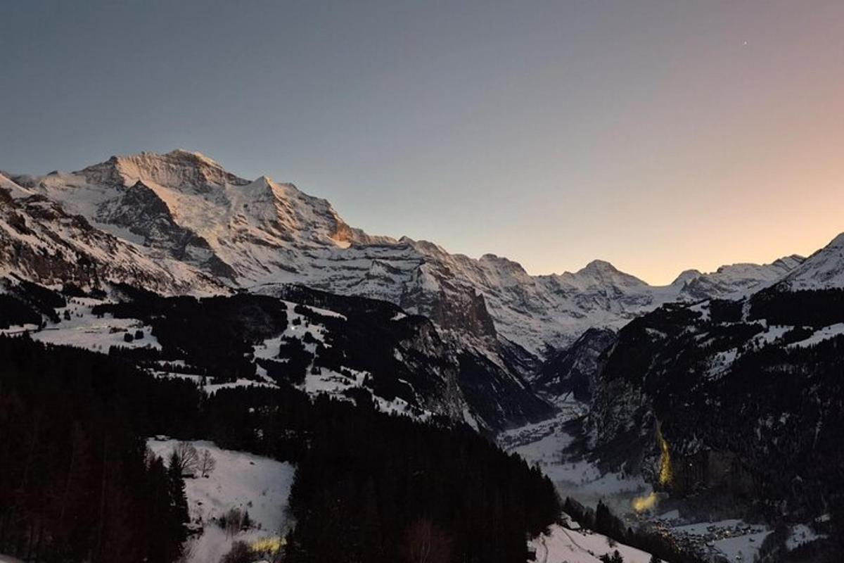 a view of a mountain range with snow covered mountains