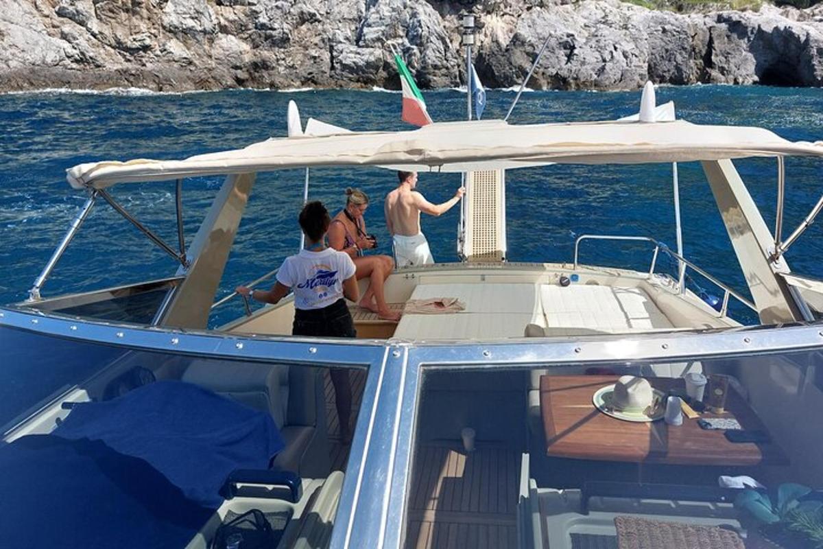 a group of people on a boat in the water