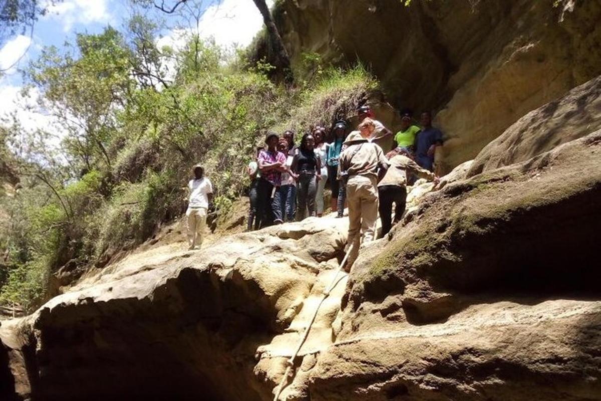 a group of people walking on a rocky mountain