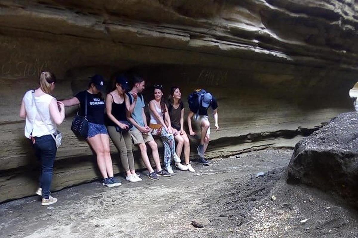 a group of people standing in a cave