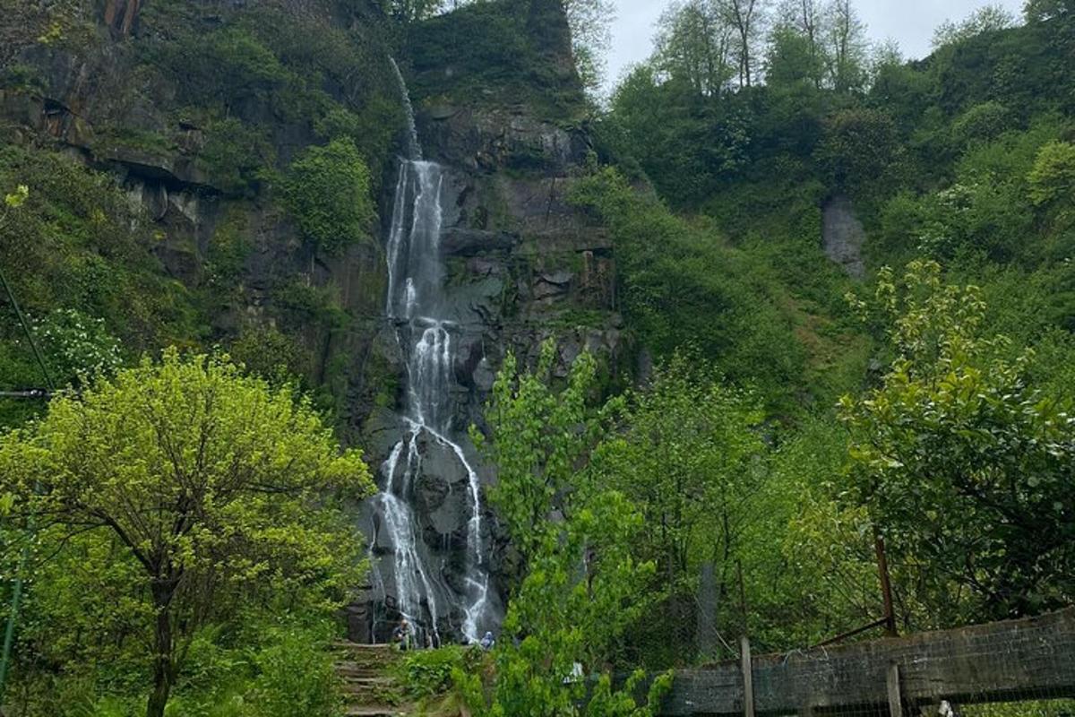 a waterfall on the side of a mountain