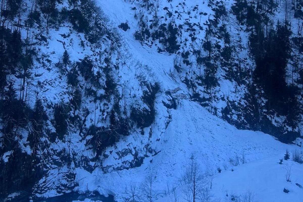 an aerial view of a snow covered mountain