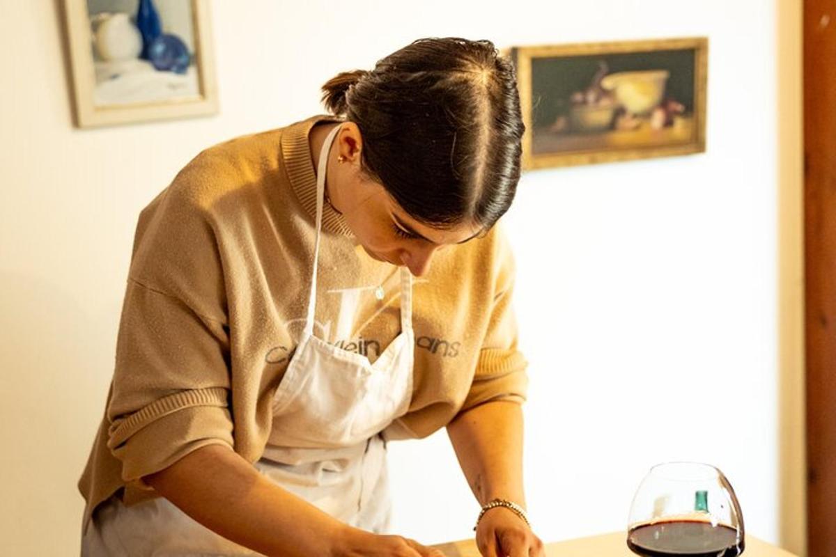 a woman in an apron preparing food in a kitchen