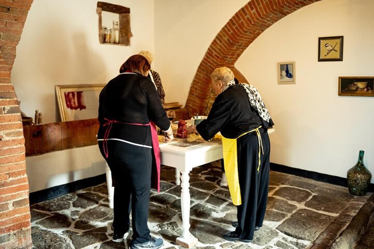 two women standing around a table in a room