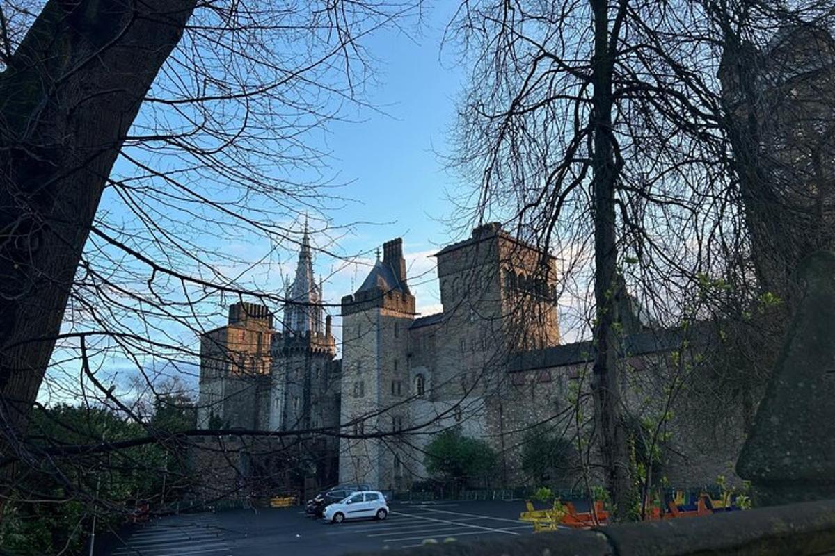 a white car parked in front of a castle