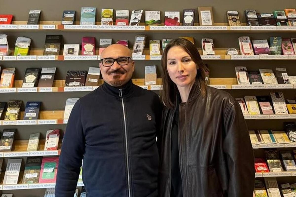 a man and a woman standing in a book store