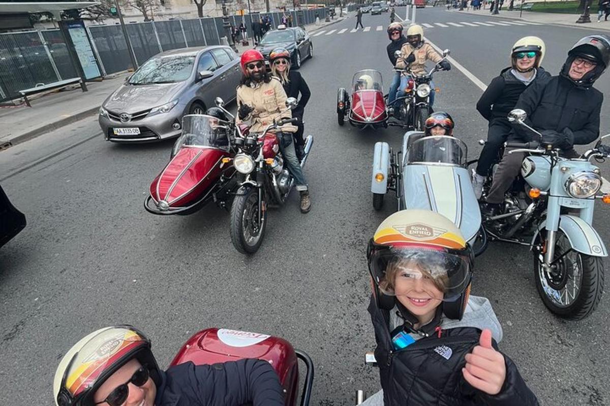 a group of people riding motorcycles down a street