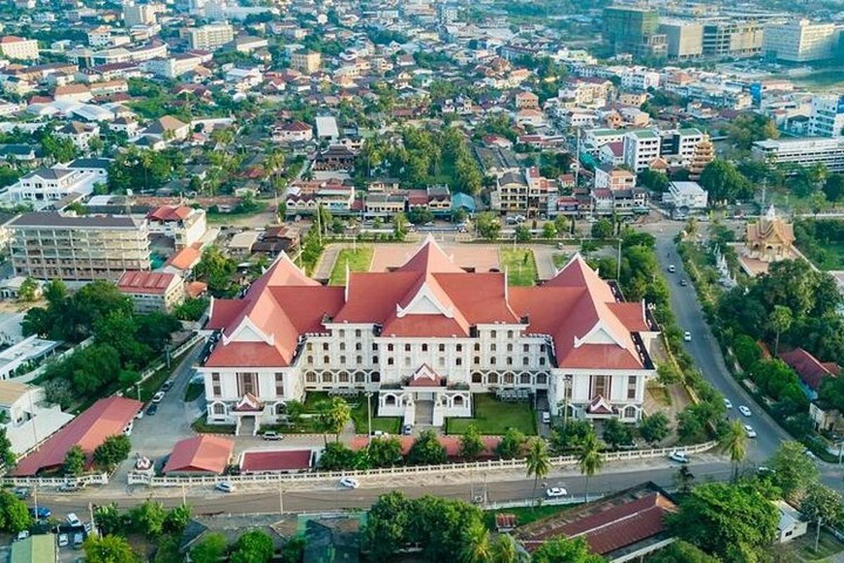 a large building with a red roof in a city
