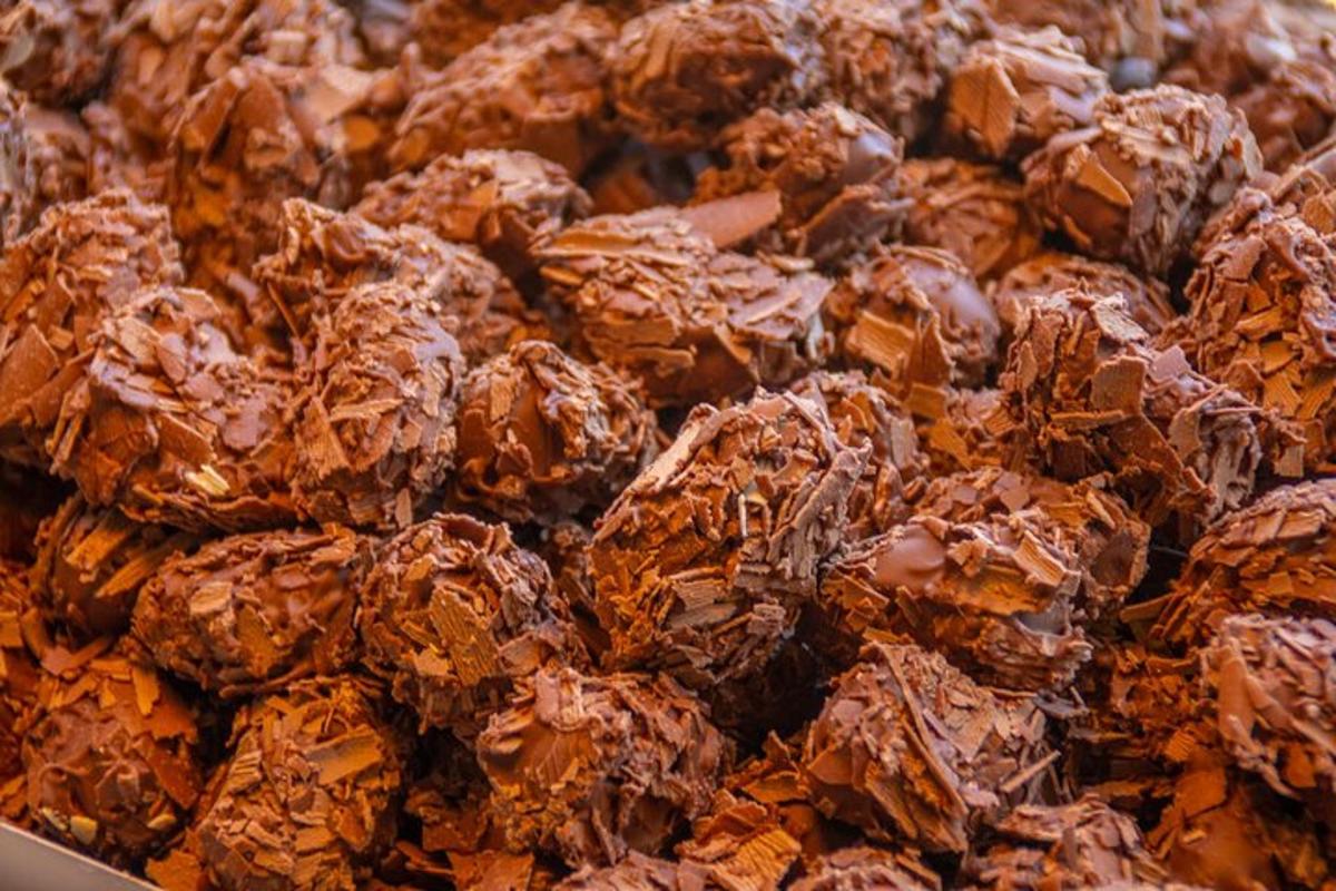 a pile of chocolate energy balls in a box