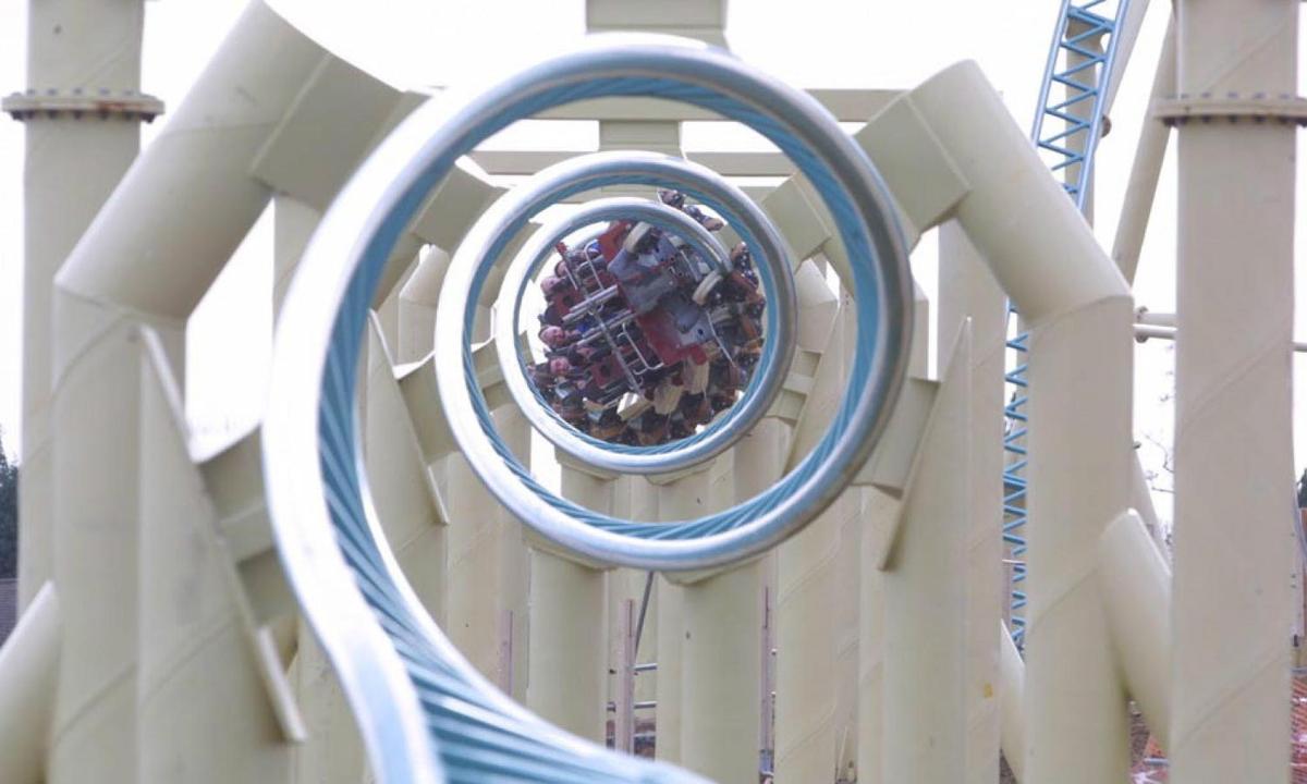 a circular mirror on a ride at a playground