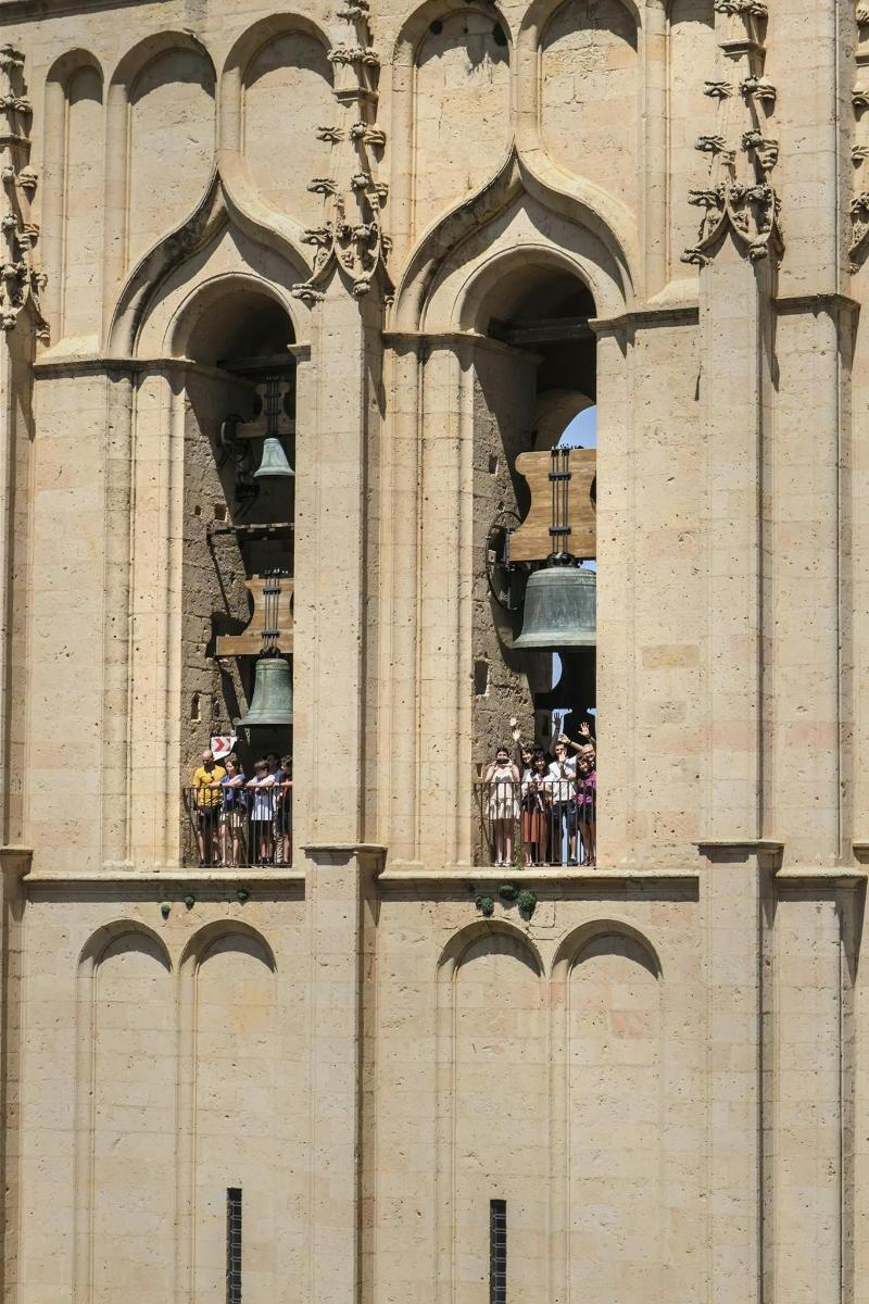 a group of people standing on top of a building
