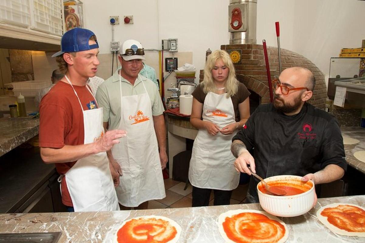 a group of people in a kitchen preparing food