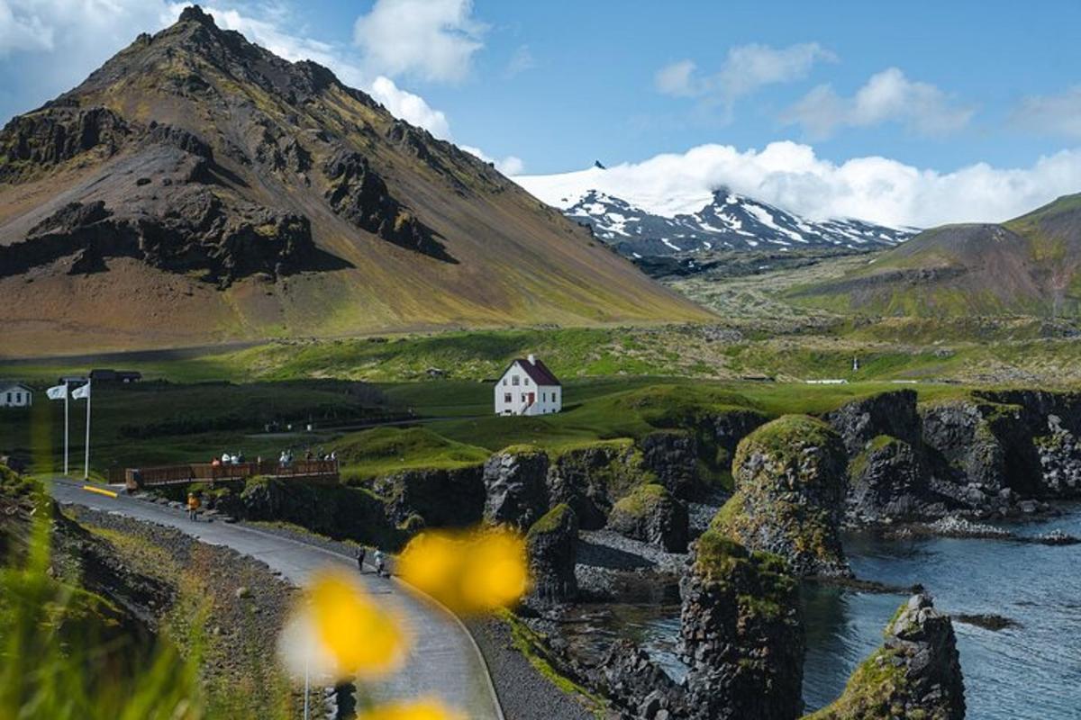 a white house on the side of a mountain