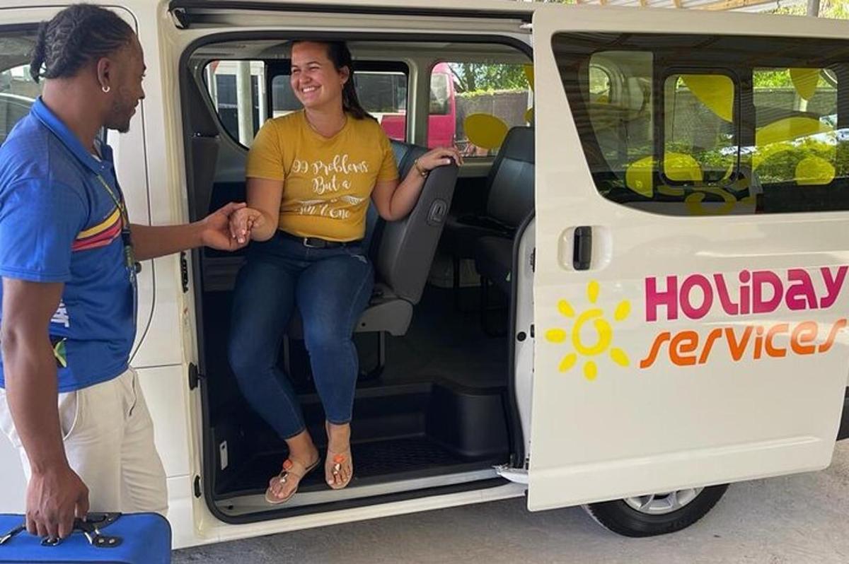 a woman is sitting in the back of a van