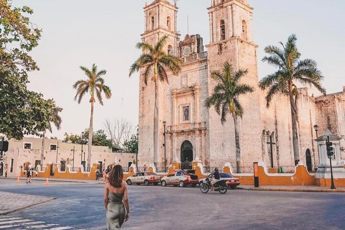 a woman walking in front of a church