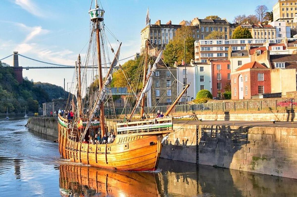 a boat in the water next to a city