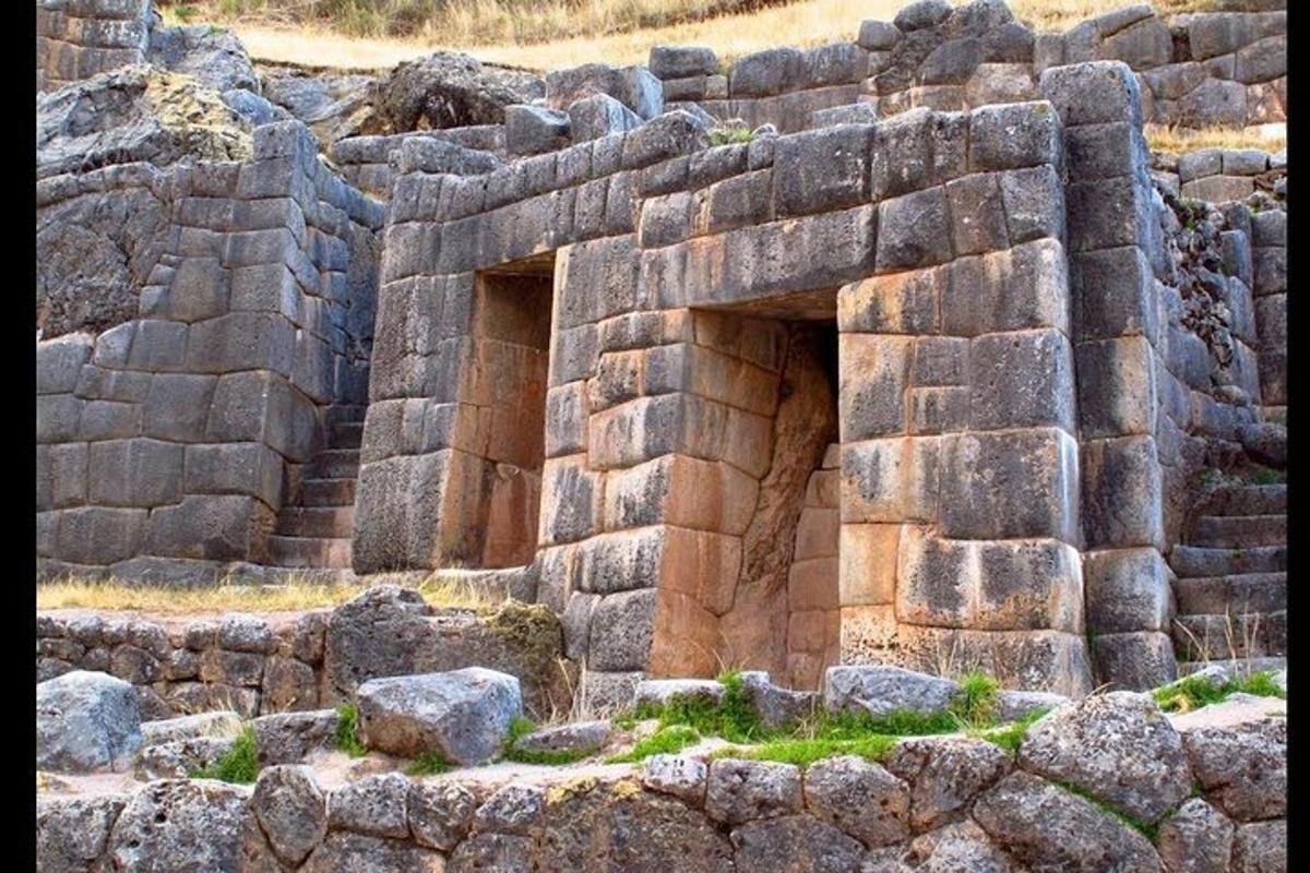 a stone wall with two openings in the middle